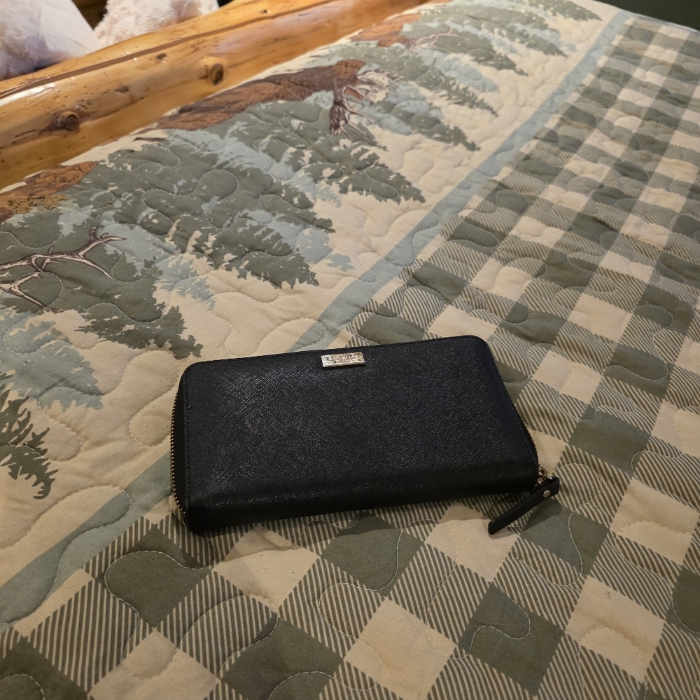 kate spade Black Zip-Around Wallet with Silver Logo Plate